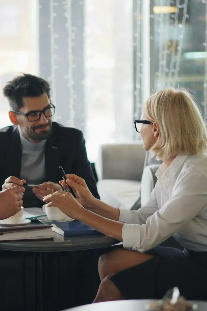 a group of people sitting around a table